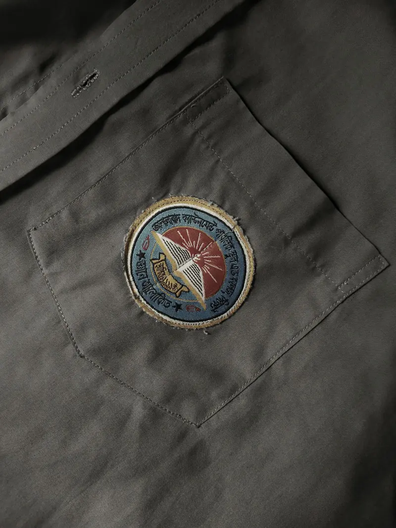 Embroidered emblem on a shirt chest pocket